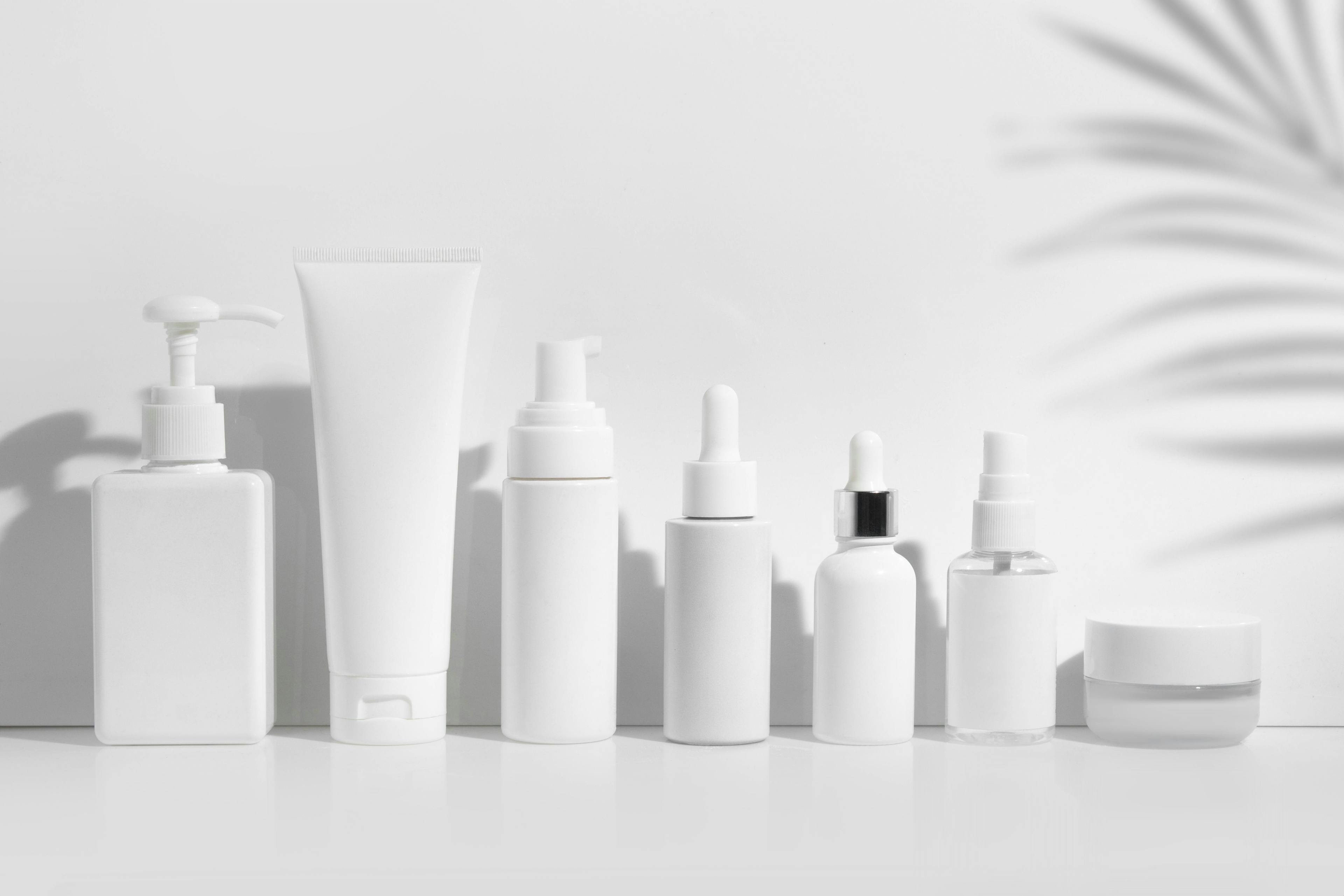 White, unlabeled skin care products in a lineup