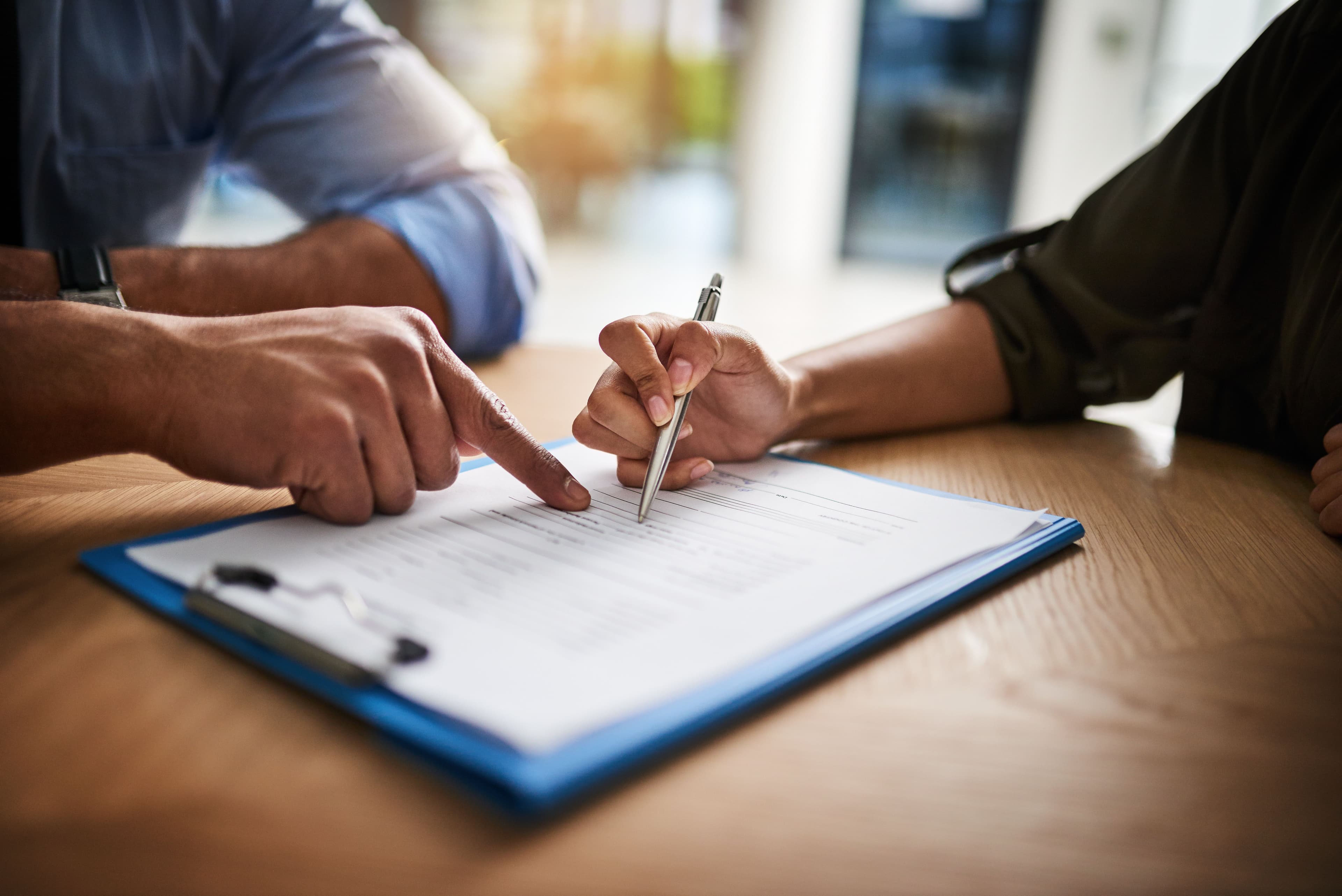 Two people looking over document | Image Credit: © Arnéll Koegelenberg/peopleimages.com - stock.adobe.com