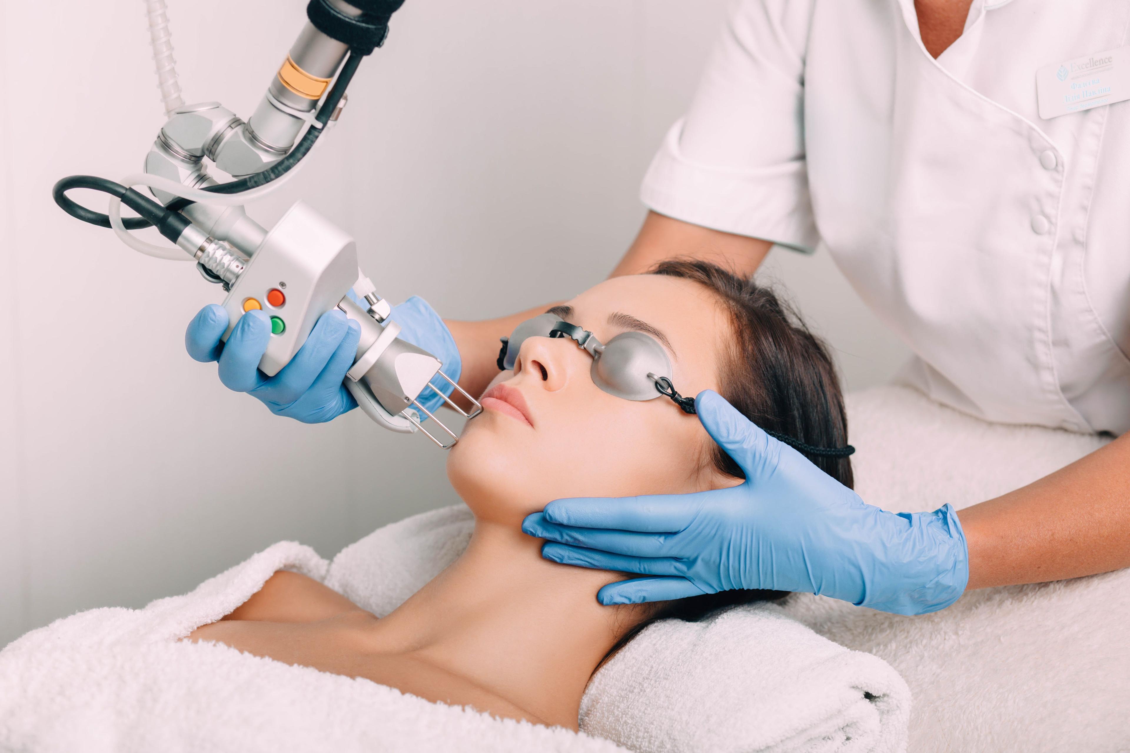 Patient receiving laser treatment | Image Credit: © Peakstock - stock.adobe.com