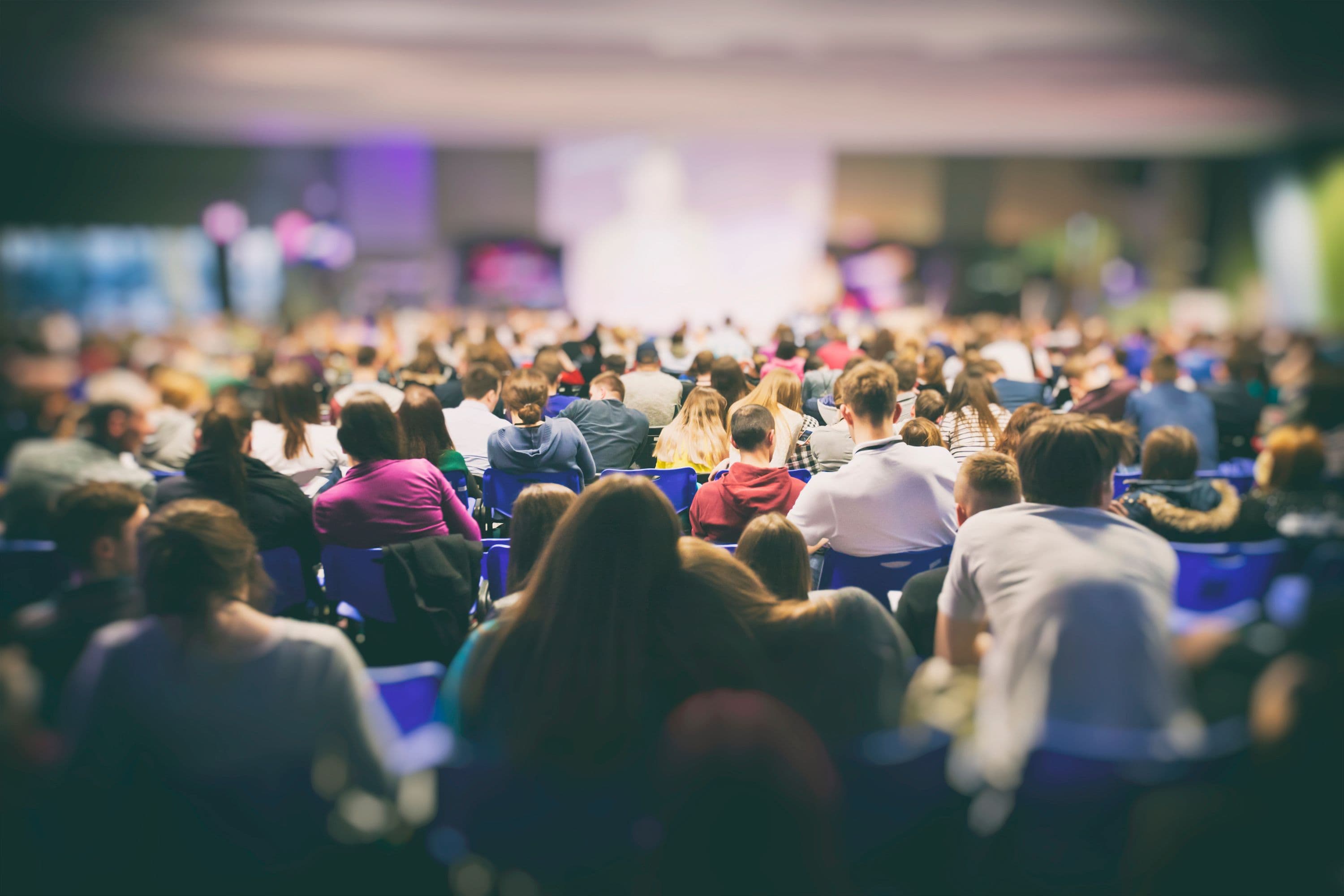 Presenter at conference giving speech